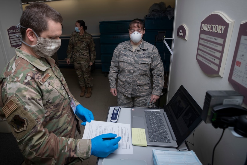 Airmen working at a veteran home.