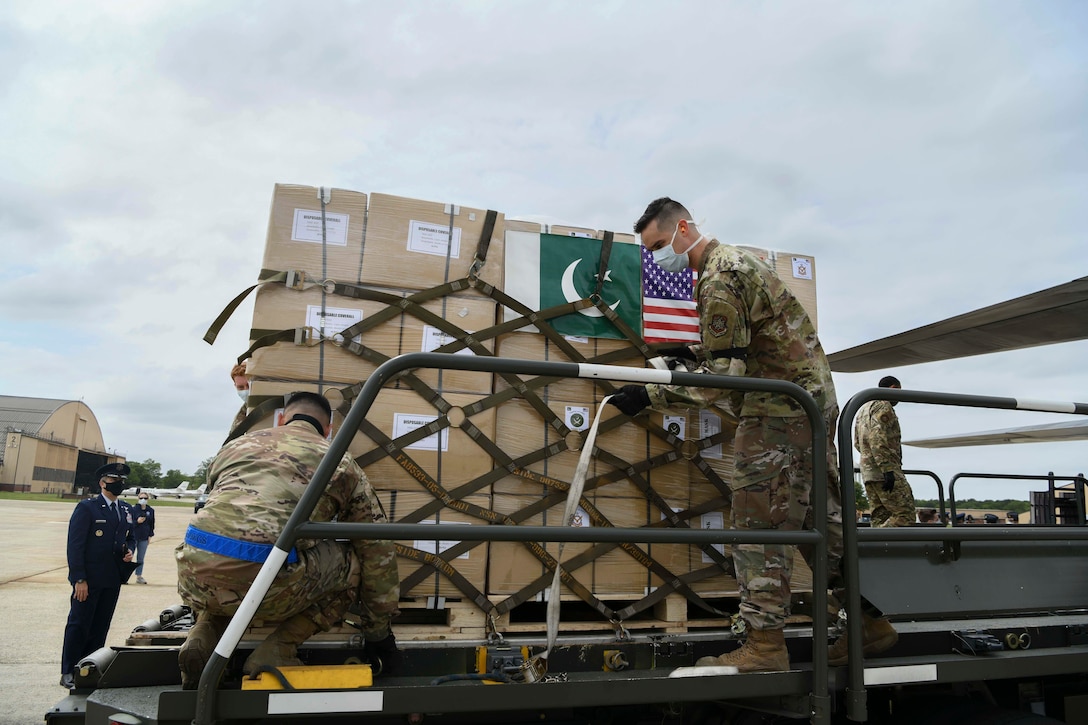 U.S. airmen unload a Pakistan Air Force C-130.