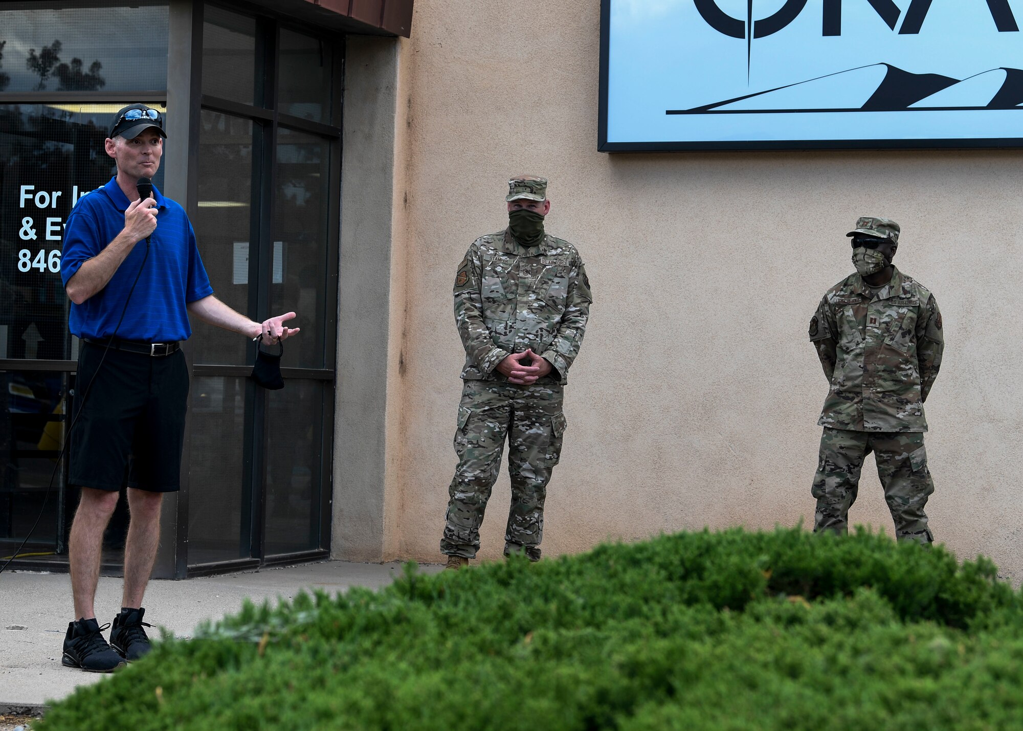 U.S. Air Force Col. David S. Miller, left, 377th Air Base Wing commander, speaks to Airmen.