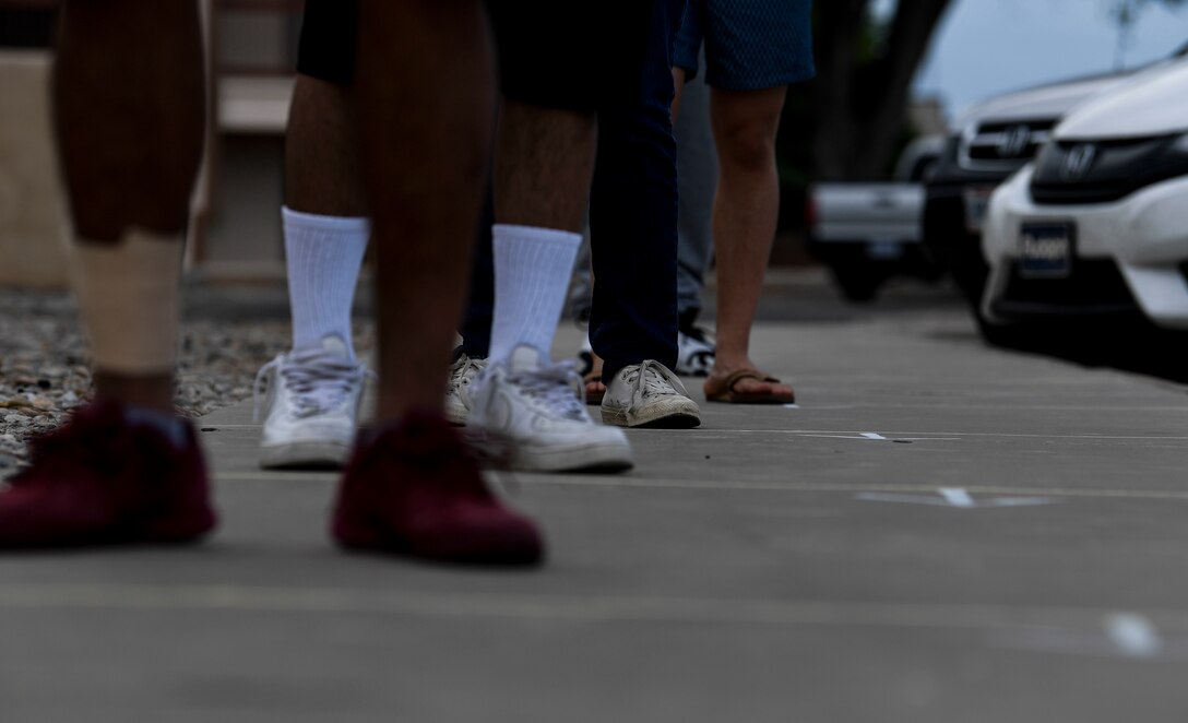 Airmen wait in line.