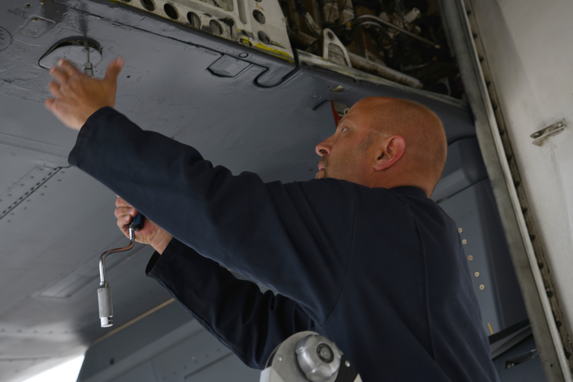 Crew chief conducts maintenance