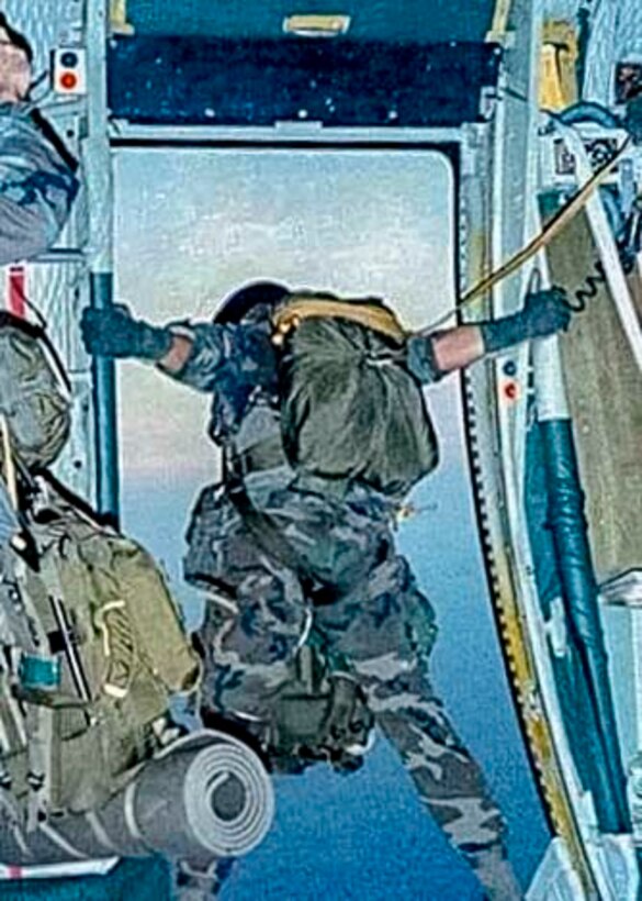 U.S. Army National Guard Jumpmaster Donald Tarrance stands in the door of an aircraft preparing to jump as part of training with the 20th Special Forces Group over Alabama, 1992. The, now, Air Force Reserve Chief Master Sgt. Donald Tarrance has served for over 40 years in a variety of positions and statuses. (Courtesy photo)