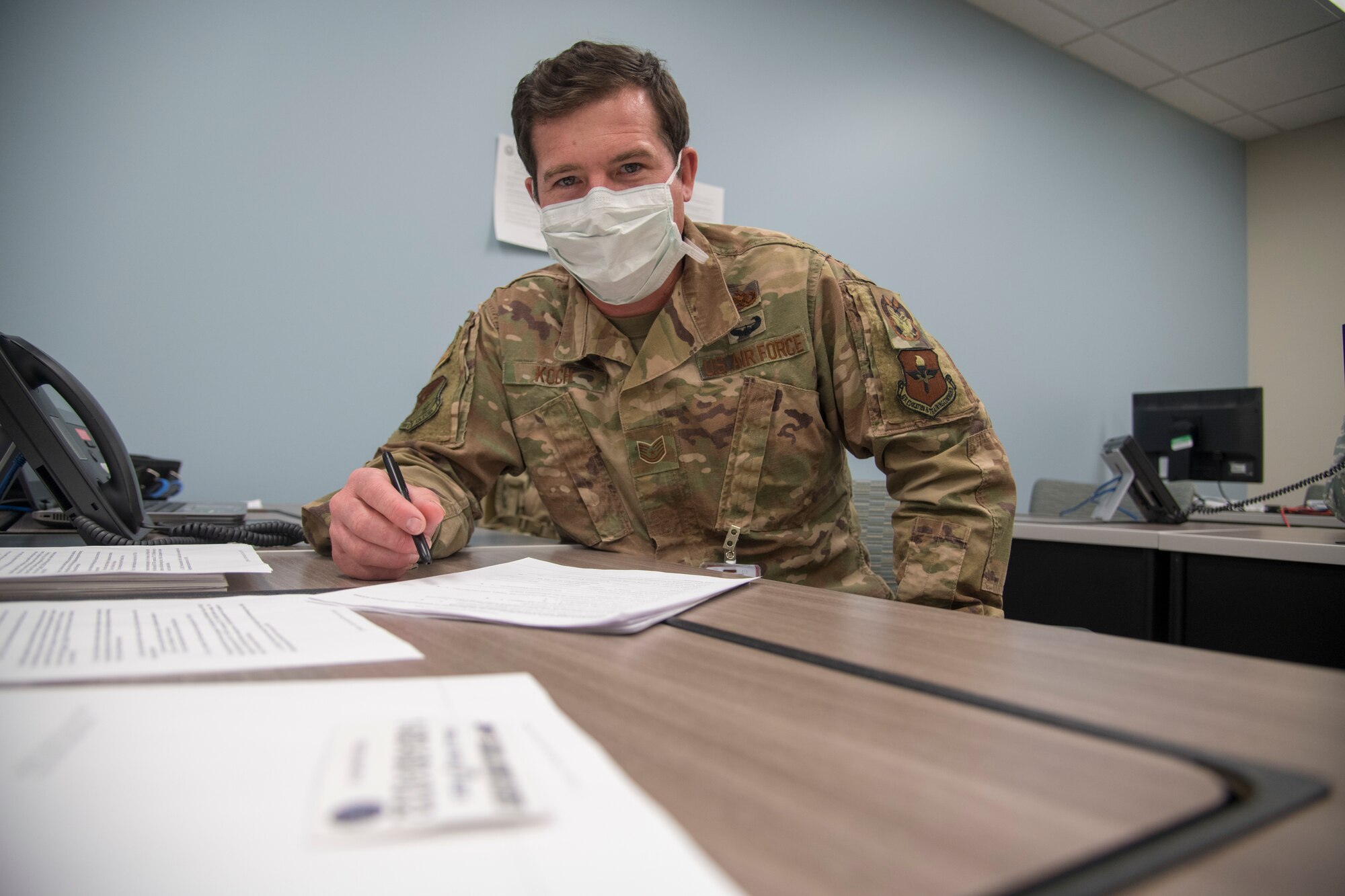 Tech. Sgt. Shawn Koch, 49th Wing Inspector General self-assessment program manager, poses for a photo, May 27, 2020, at the 49th Medical Group public health call center on Holloman Air Force Base, N.M. Koch volunteered at the call center for approximately two months. His duties included assisting callers with their questions, ranging from Holloman’s current traveling policy to general COVID-19 related questions, ensuring everyone stayed safe and informed during COVID-19. (U.S. Air Force photo by Senior Airman Collette Brooks)