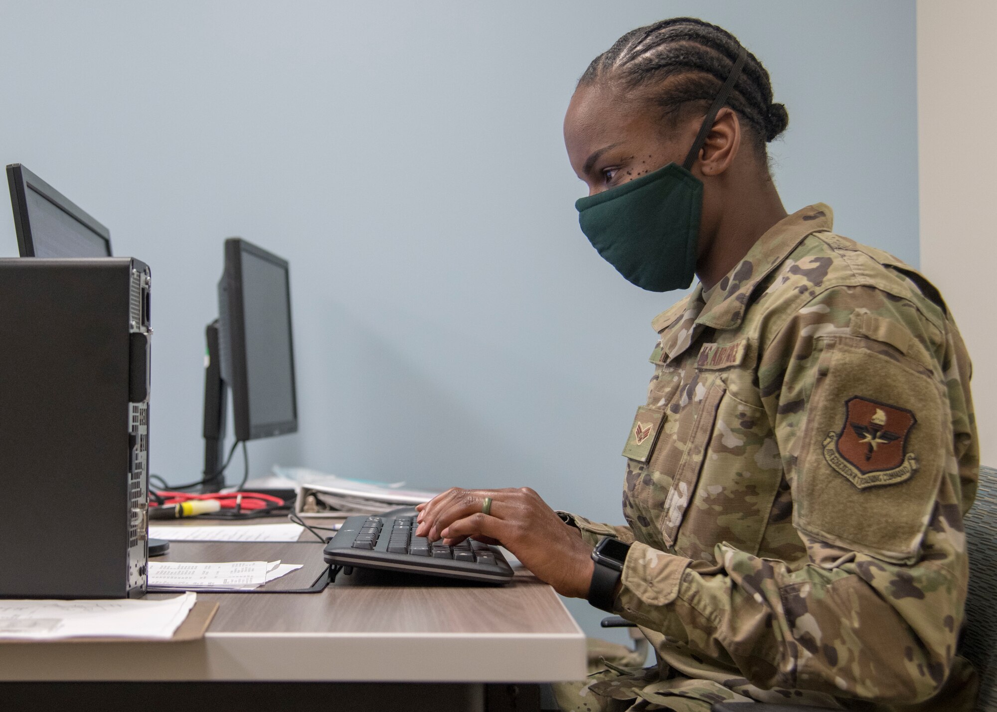 Senior Airman Juanita Black, Operational Medical Readiness Squadron dental assistant, works on a computer, May 27, 2020, at the 49th Medical Group public health call center on Holloman Air Force Base, N.M. Black’s duties included assisting callers with their questions, ranging from Holloman’s current traveling policy to general COVID-19 related questions, ensuring everyone stayed safe and informed during COVID-19. (U.S. Air Force photo by Senior Airman Collette Brooks) (U.S. Air Force photo by Senior Airman Collette Brooks)