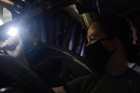 Airman 1st Class Kathryn Danley, 62nd Maintenance Squadron jet mechanic, adjusts machinery inside a C-17 Globemaster III engine on Joint Base Lewis-McChord, Wash., May 20, 2020. Every 180 days a C-17 receives a home station check, during which it undergoes a thorough safety and functionality inspection. (U.S. Air Force photo by Airman 1st Class Mikayla Heineck)