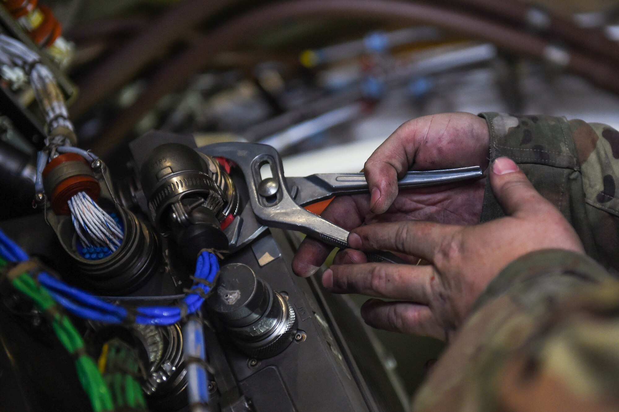Staff Sgt. Jonathan Daniels, 62nd Maintenance Squadron jet mechanic, tightens a part on the electronic engine system for a C-17 Globemaster III on Joint Base Lewis-McChord, Wash., May 20, 2020. Jet mechanics specialize in work on the engines of C-17s, whereas crew chiefs conduct maintenance on other areas of the aircraft. (U.S. Air Force photo by Airman 1st Class Mikayla Heineck)