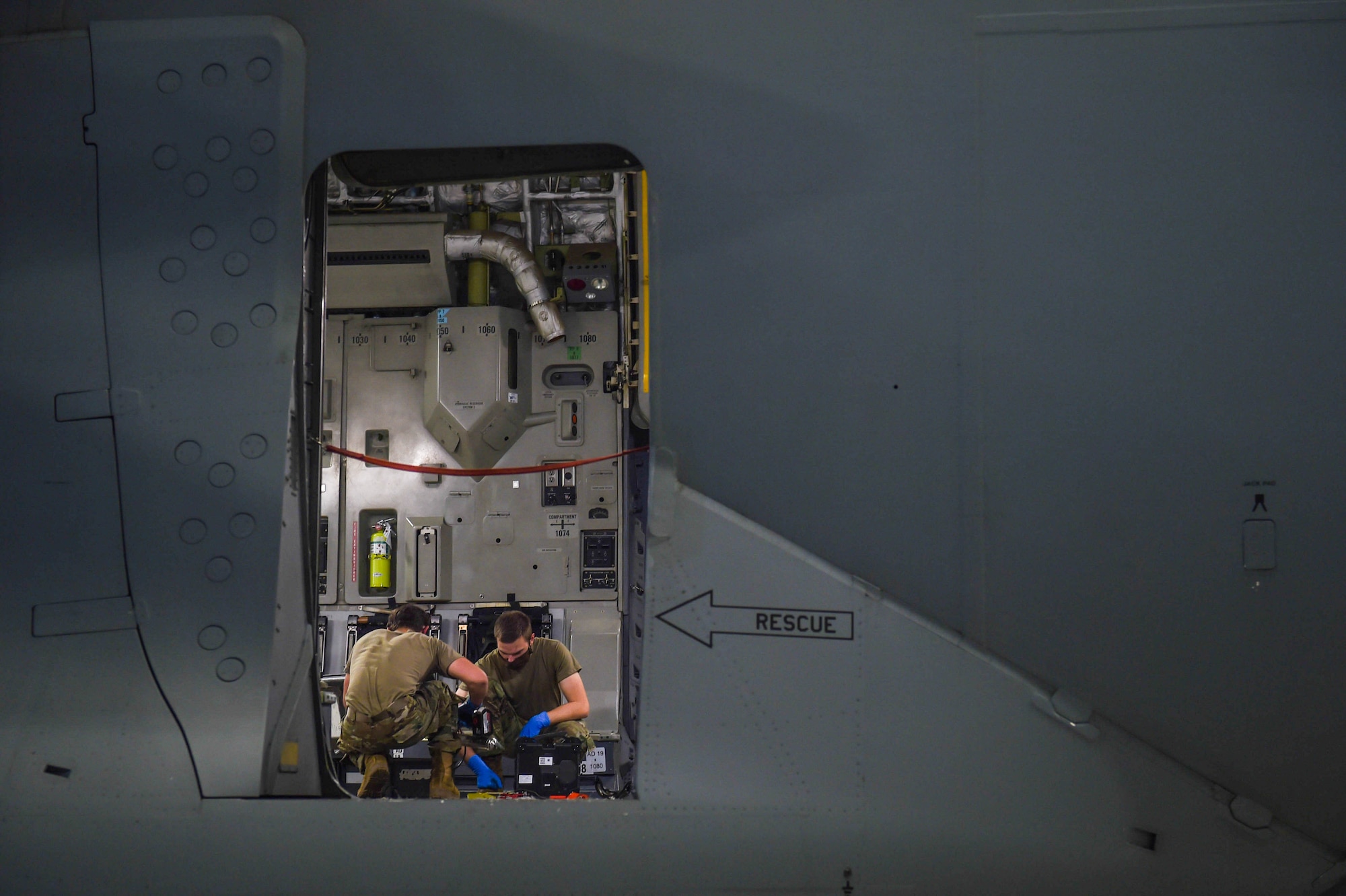 Airman 1st Class Michael Pinney and Airman 1st Class Jordan Hixson, 62nd Maintenance Squadron crew chiefs, work on lubricating the air deflectors of a C-17 Globemaster III on Joint Base Lewis-McChord, Wash., May 20, 2020. Every 180 days a C-17 receives a home station check, during which it undergoes a thorough safety and functionality inspection. (U.S. Air Force photo by Airman 1st Class Mikayla Heineck)