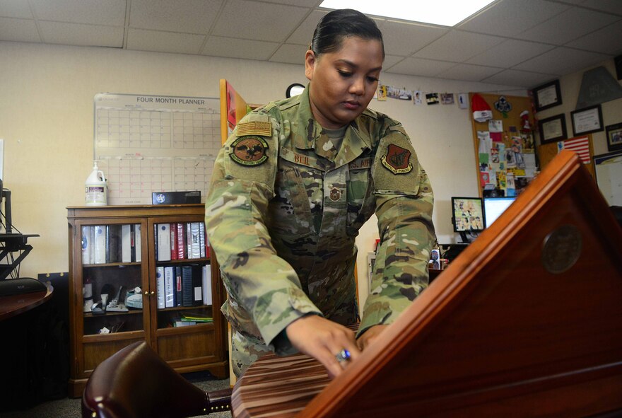 U.S. Air Force Master Sgt. Stephanie Beil, the 354th Force Support Squadron operations flight superintendent, places a flag in a case at Eielson Air Force Base, Alaska, June 1, 2020. One of Beils responsibilities is to maintain is the base’s mortuary affairs program. (U.S. Air Force photo by Staff Sgt. Sean Martin)