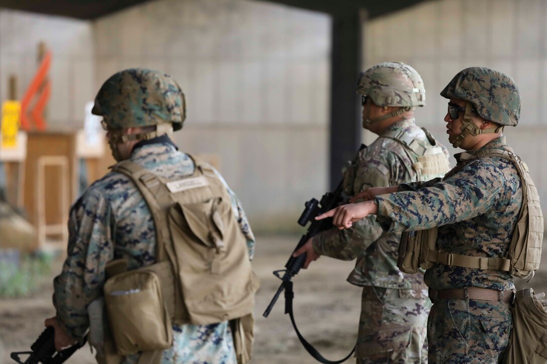 Marines from U.S. Marine Corps Forces Korea were invited to train alongside the 557th Military Police Company here on Camp Humphreys, South Korea, May 14. The joint training allowed the Marines and Soldiers to practice their marksmanship and maintain their overall readiness. (U.S. Marine Corps Photo by Sgt. Parker R. Golz)