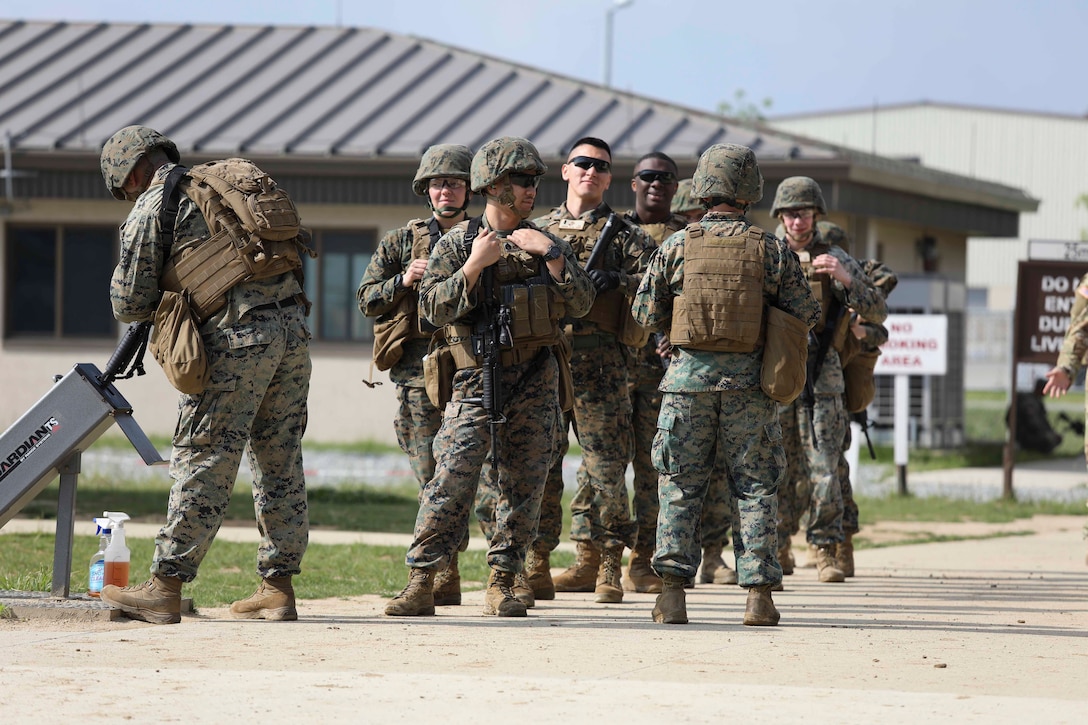 Marines from U.S. Marine Corps Forces Korea were invited to train alongside the 557th Military Police Company here on Camp Humphreys, South Korea, May 27. The joint training allowed the Marines and Soldiers to practice their marksmanship and maintain their overall readiness. (U.S. Marine Corps Photo by Sgt. Parker R. Golz)