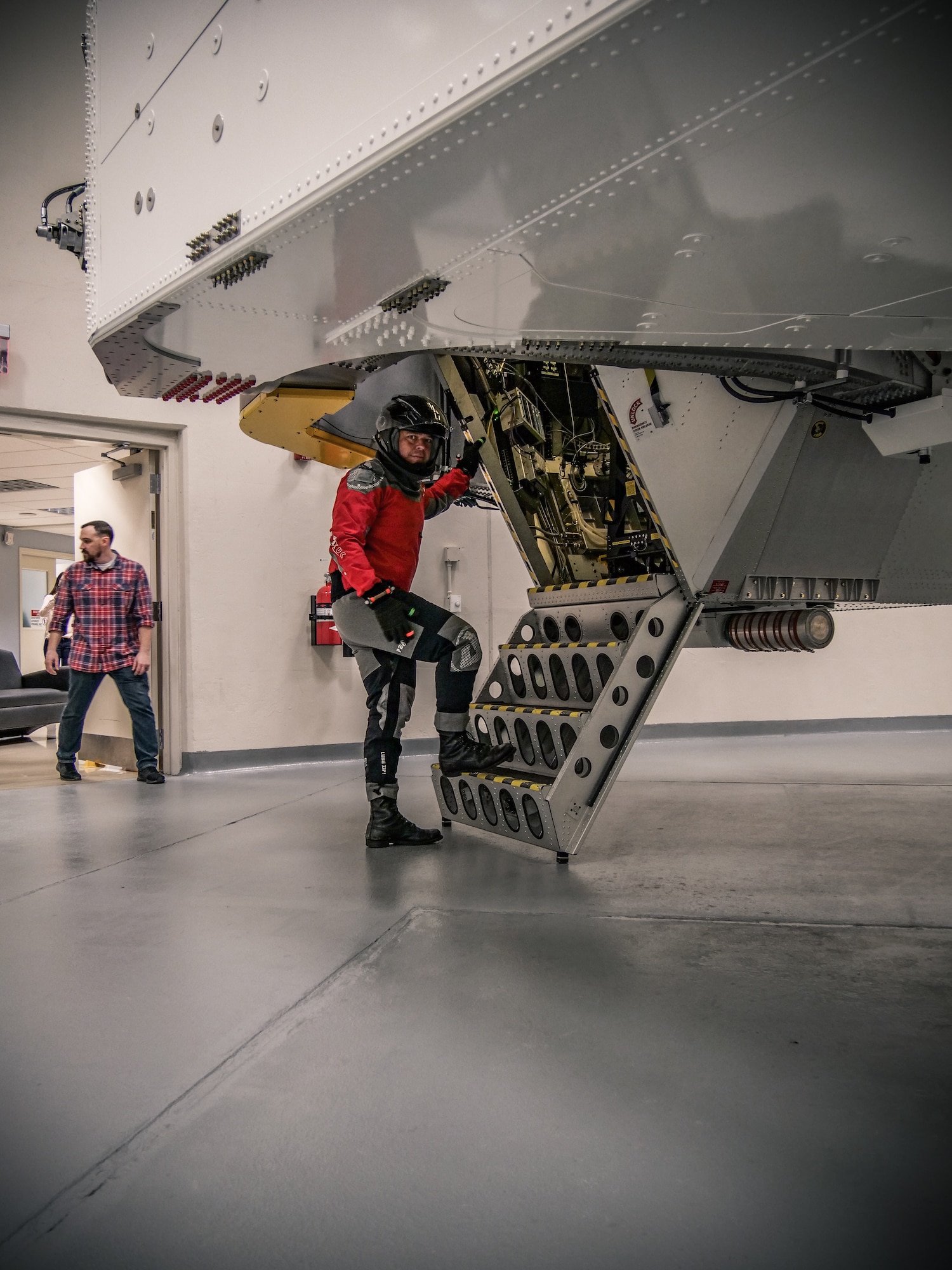 NASA astronaut Bob Behnken stops for the camera moments before going inside the Air Force Research Laboratory’s centrifuge for his spin during testing Nov. 2, 2018 at the Air Force Research Laboratory's centrifuge facility. (U.S. Air Force photo / Keith Lewis)