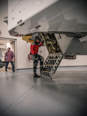 NASA astronaut Bob Behnken stops for the camera moments before going inside the Air Force Research Laboratory’s centrifuge for his spin during testing Nov. 2, 2018 at the Air Force Research Laboratory's centrifuge facility. (U.S. Air Force photo / Keith Lewis)