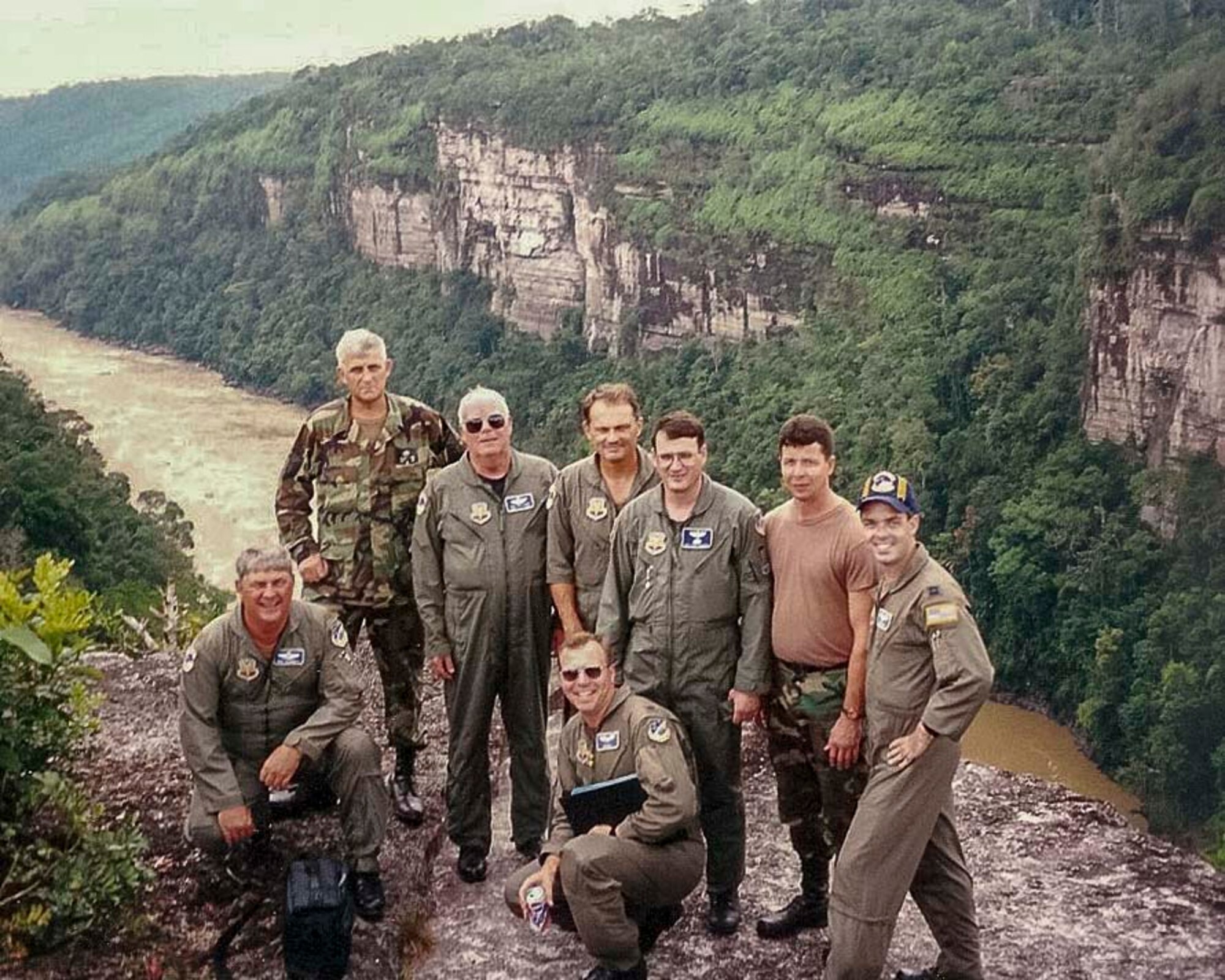 Air Force Reserve crew members pose on a cliff at Araracuara, Colombia, 1997. Prior to being a loadmaster, Tarrance also served as an aeromedical evacuation technician, flight medical aidman, and a jumpmaster. (Courtesy photo)