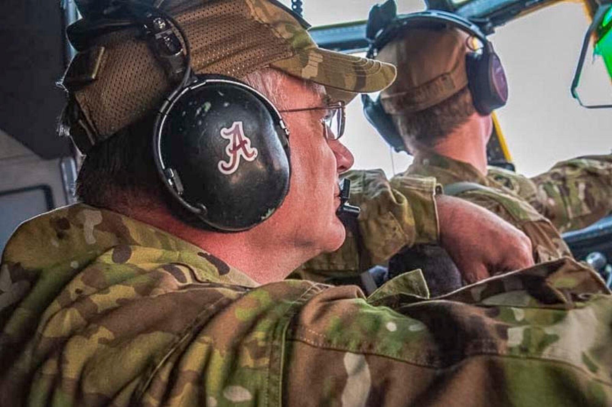Air Force Reserve Chief Master Sgt. Donald Tarrance sits in the jump seat of a C-130J Hercules aircraft behind the pilots. Tarrance has served for over 40 years and has over 4,500 flight hours as a loadmaster. (Courtesy photo)