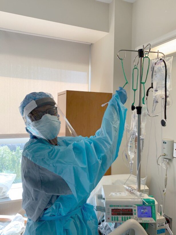 Maj. Enrika Ross, 94th Aeromedical Staging Squadron nursing OIC, poses for a photo inside New York City’s Queens Hospital, where she worked as a nurse in the medical-surgical unit as part of the whole-of-government response to the COVID-19 pandemic. For the last couple months, thousands of medical personnel from Air Force Reserve Command have been working alongside their military and civilian counterparts in the U.S. Army North-led Joint Forces Land Component Command. (Courtesy photo)