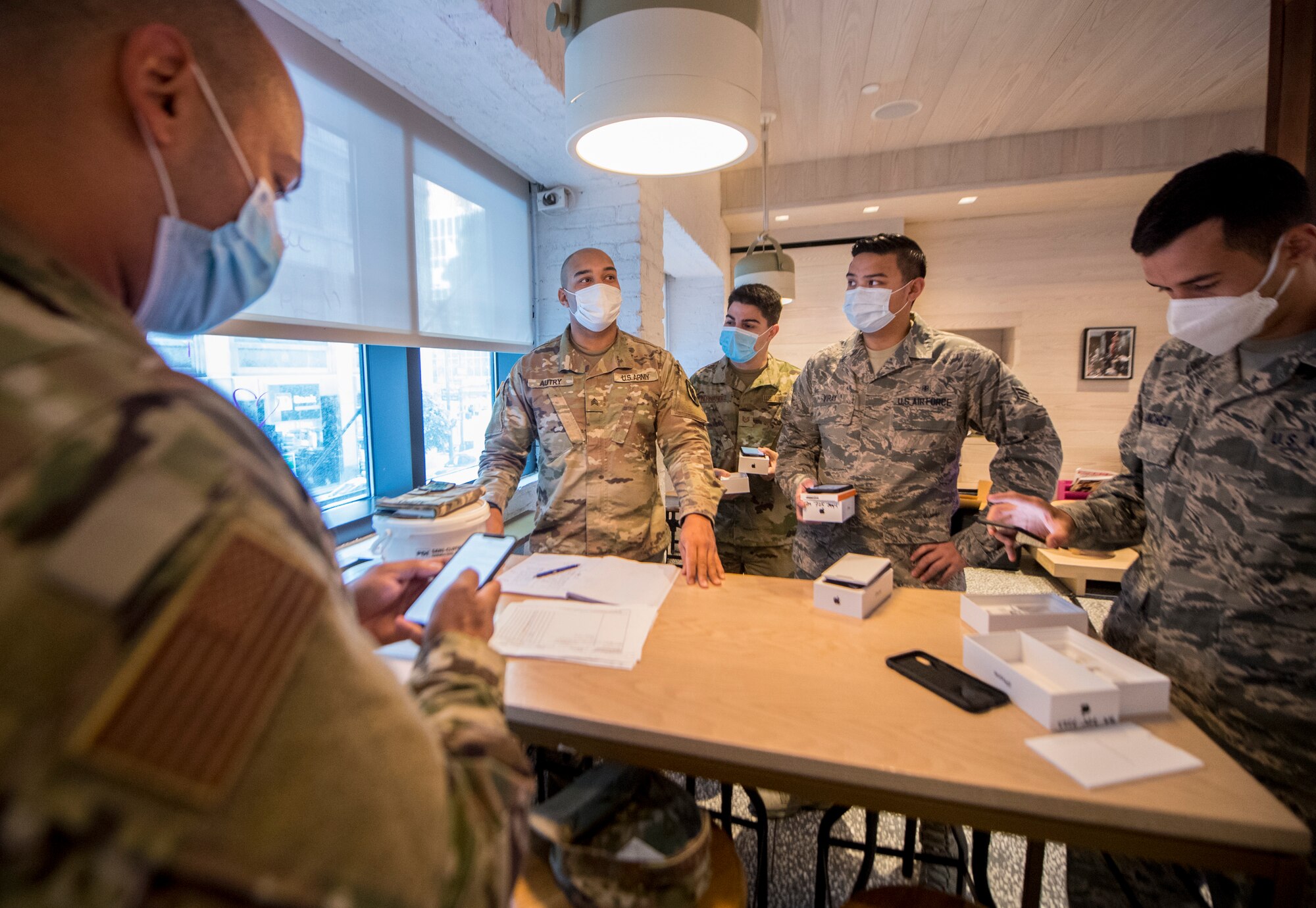 Photo of individuals resetting their Joint All-Domain Command and Control devices.