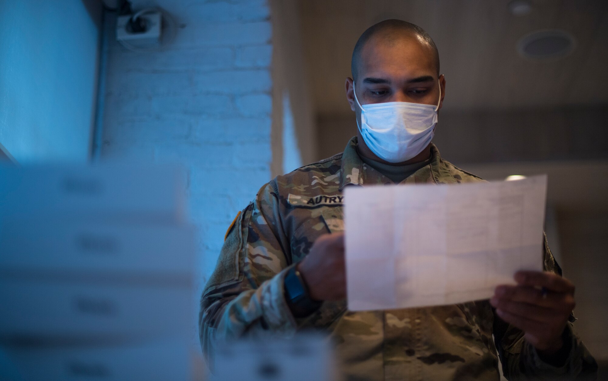 Photo of an Airman confirming serial numbers.
