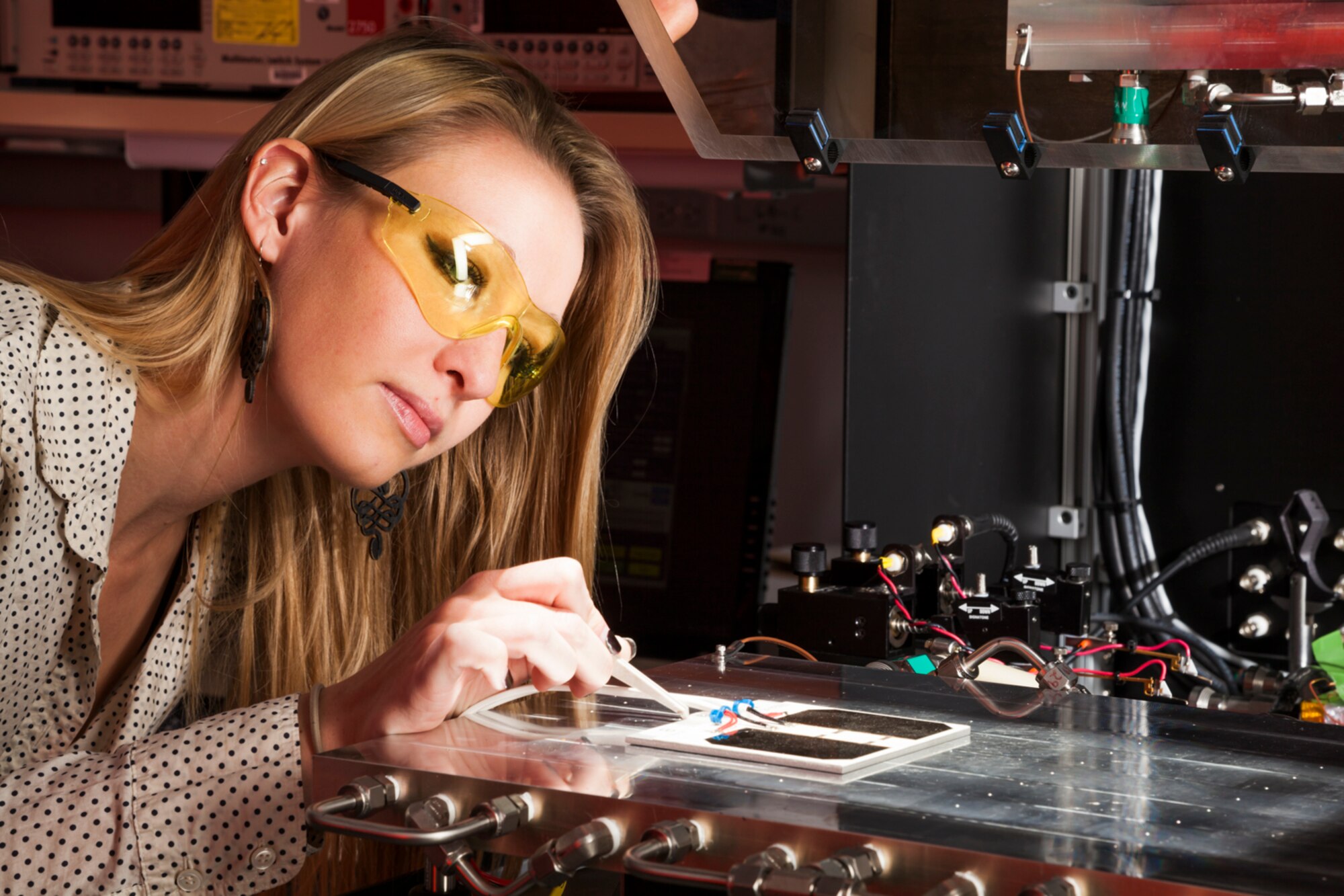 Woman looking at a piece of technical equipment
