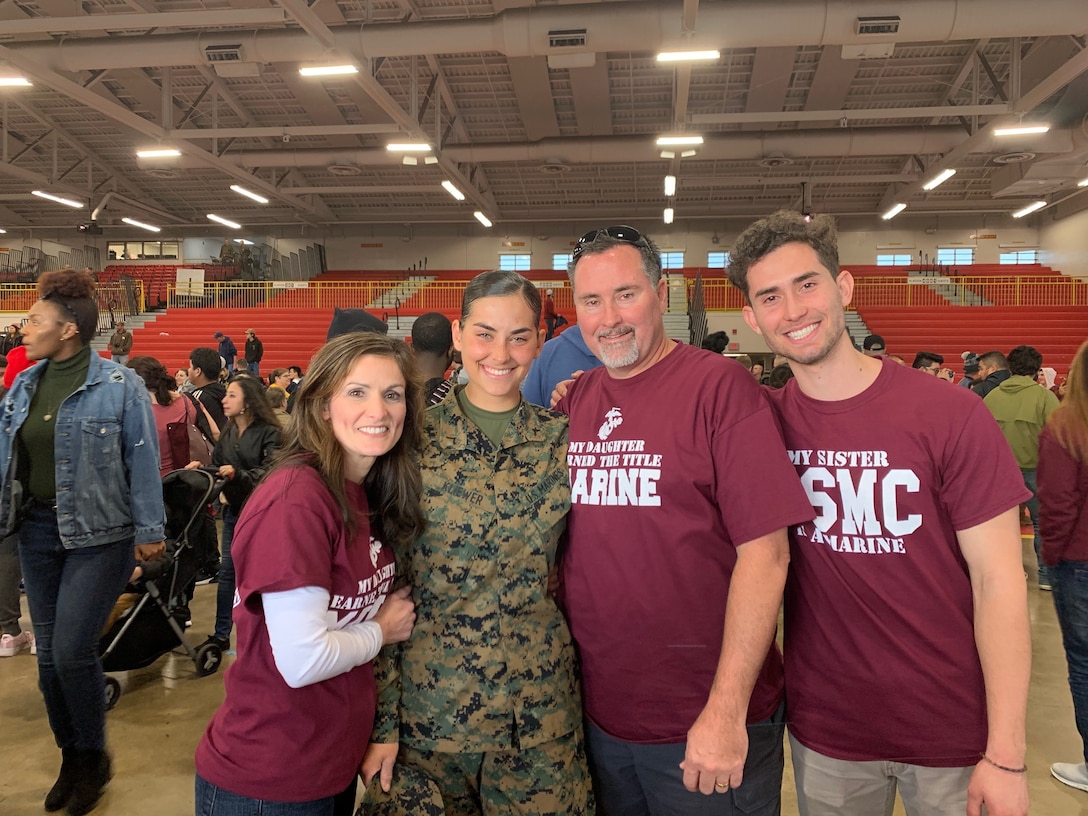 Marine Corps Pfc. Jacqueline Kliewer, a Marine musician, poses for a photo with her family at Marine Corps Recruit Depot Parris Island, Jan. 2.