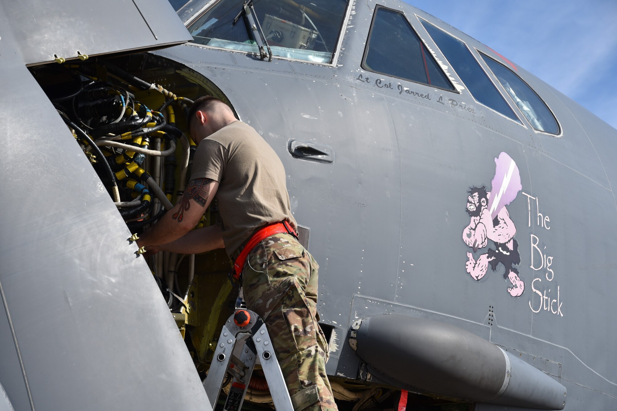 Staff Sgt. Derrick Ewing, a maintainer with the 5th Aircraft Maintenance Squadron, Minot Air Force Base, North Dakota, disconnects breaker boxes on a B-52H Stratofortress bomber from the 2nd Bomb Wing, Barksdale AFB, Louisiana on Jan. 27.  The aircraft is undergoing electromagnetic pulse hardness testing at the Compass Rose facility here. (U.S. Air Force photo/Ron Mullan)