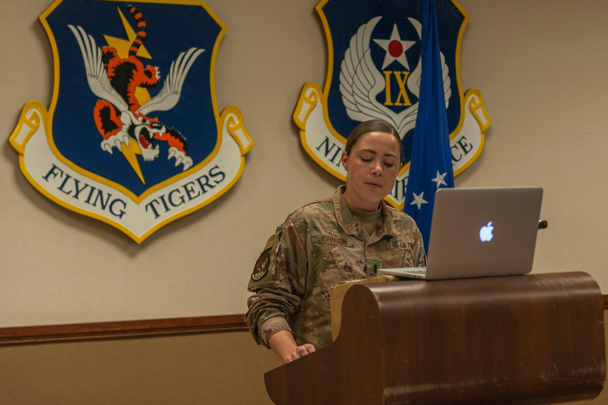 Photo of Airman announcing award recipients