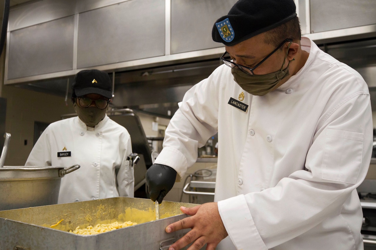 Soldiers working while wearing personal protective equipment.