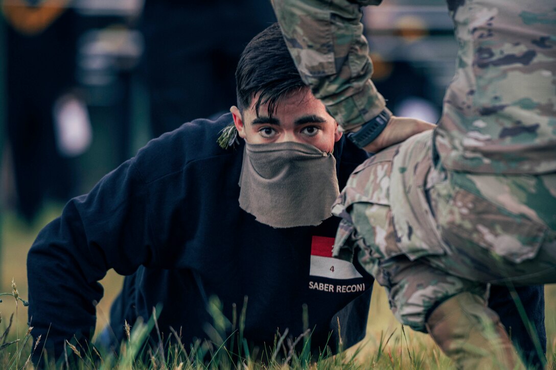 A soldier performs pushups.