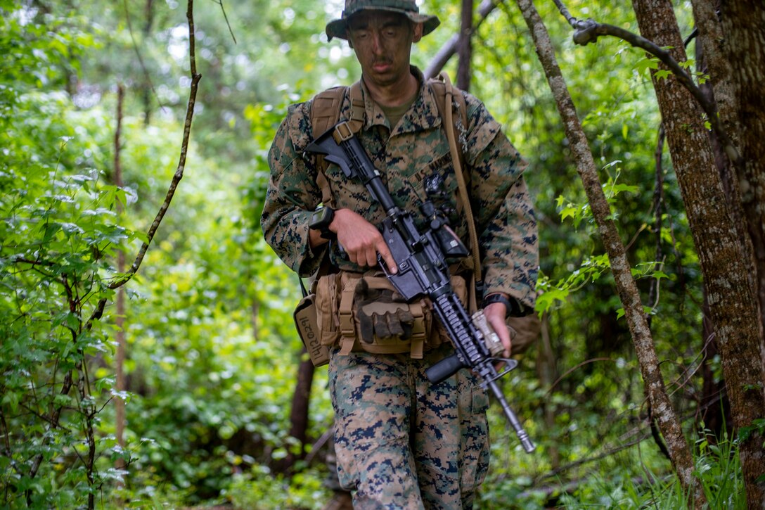 A Marine with Special Purpose Marine Air-Ground Task Force - Southern Command conducts a reconnaissance patrol during a field exercise at Camp Lejeune, North Carolina, May 6, 2020. These training events assist the Marines and Sailors when working alongside partner nations in Latin America and the Caribbean with crisis response preparedness, security cooperation training, and engineering projects. (U.S. Marine Corps photo by Sgt. Andy O. Martinez)