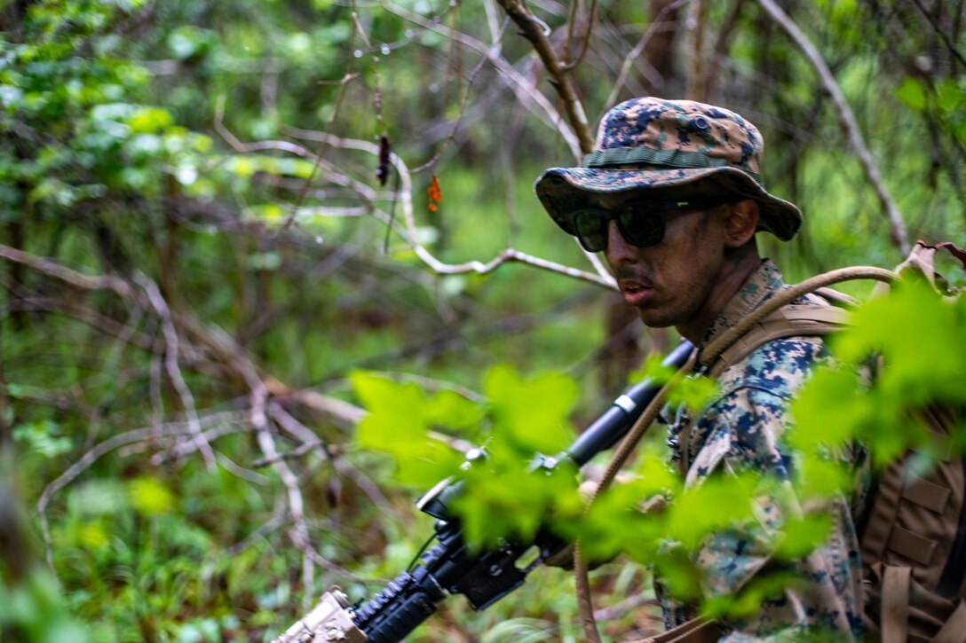 Marines with Special Purpose Marine Air-Ground Task Force - Southern Command conduct a reconnaissance patrol during a field exercise at Camp Lejeune, North Carolina, May 6, 2020. These training events assist the Marines and Sailors when working alongside partner nations in Latin America and the Caribbean with crisis response preparedness, security cooperation training, and engineering projects. (U.S. Marine Corps photo by Sgt. Andy O. Martinez)