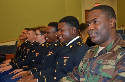 Pfc. Yardy Collins (far right) was the first international student from Liberia to graduate from the Medical Education and Training Campus Preventive Medicine program in October 2017.