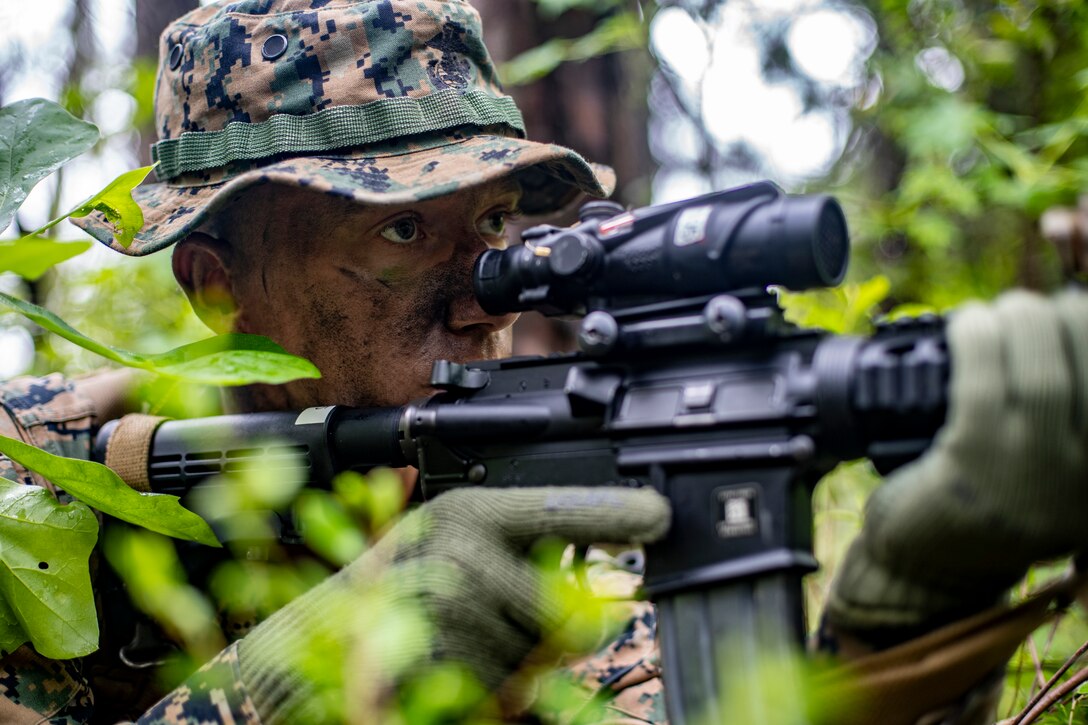 Cpl. Geoffrey Daily, a field radio operator with Special Purpose Marine Air-Ground Task Force - Southern Command, provides security during a field exercise at Camp Lejeune, North Carolina, May 6, 2020. These training events assist the Marines and Sailors when working alongside partner nations in Latin America and the Caribbean with crisis response preparedness, security cooperation training, and engineering projects. Daily is a native of Bellingham, Washington. (U.S. Marine Corps photo by Sgt. Andy O. Martinez)