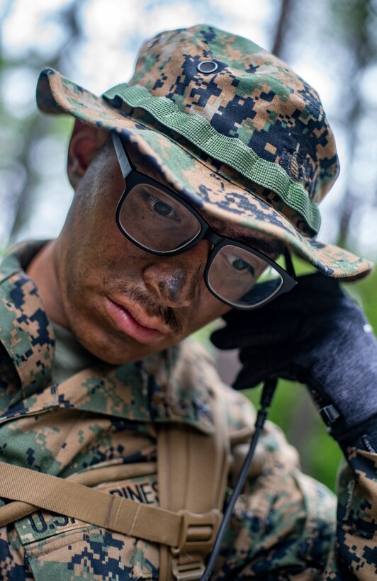 Lance Cpl. Dezmond Gomez, a field radio operator with Special Purpose Marine Air-Ground Task Force - Southern Command, conducts a radio check during a field exercise at Camp Lejeune, North Carolina, May 6, 2020. These training events assist the Marines and Sailors when working alongside partner nations in Latin America and the Caribbean with crisis response preparedness, security cooperation training, and engineering projects. Gomez is a native of Kansas City, Missouri. (U.S. Marine Corps photo by Sgt. Andy O. Martinez)