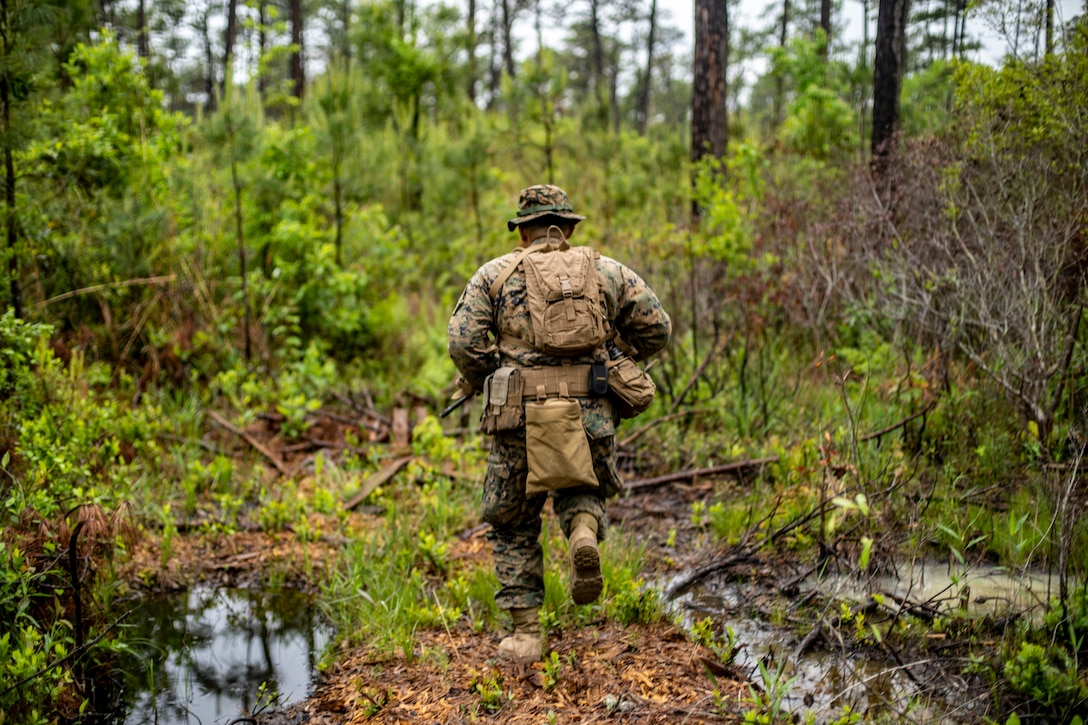 A Marine with Special Purpose Marine Air-Ground Task Force - Southern Command conducts a reconnaissance patrol during a field exercise at Camp Lejeune, North Carolina, May 6, 2020. These training events assist the Marines and Sailors when working alongside partner nations in Latin America and the Caribbean with crisis response preparedness, security cooperation training, and engineering projects. (U.S. Marine Corps photo by Sgt. Andy O. Martinez)