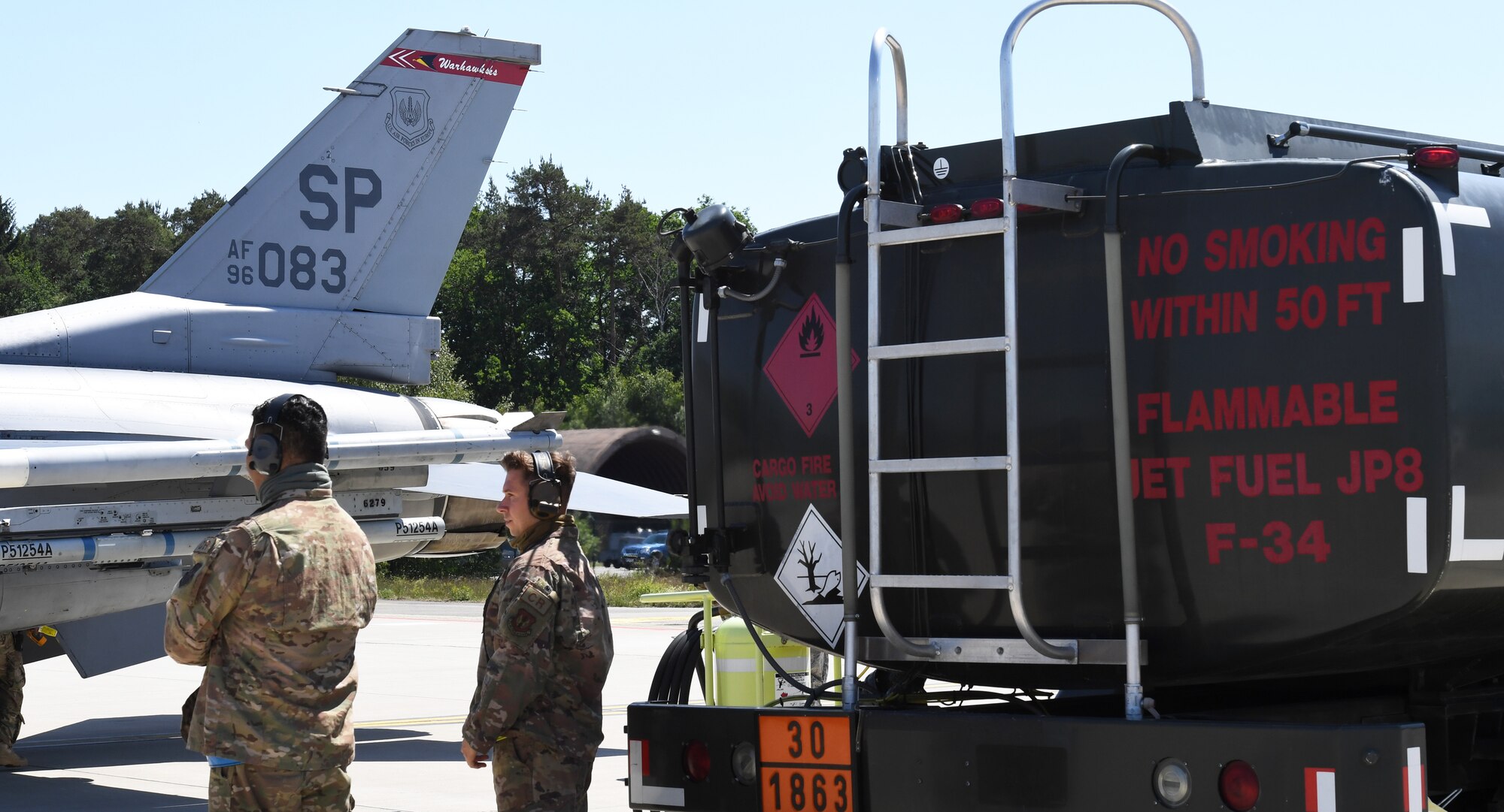 435th Contingency Readiness Squadron fuels Airmen prepare a JP-8 fuel truck to deliver fuel to an F-16 Fighting Falcon aircraft at Ramstein Air Base, Germany, May 28, 2020. The "hot-pit refuel" was part of an Agile Combat Employment exercise to test the capability of delivering fuel to an aircraft during a fast-paced contingency operation. (U.S. Air Force photo by Airman 1st Class Alison Stewart)