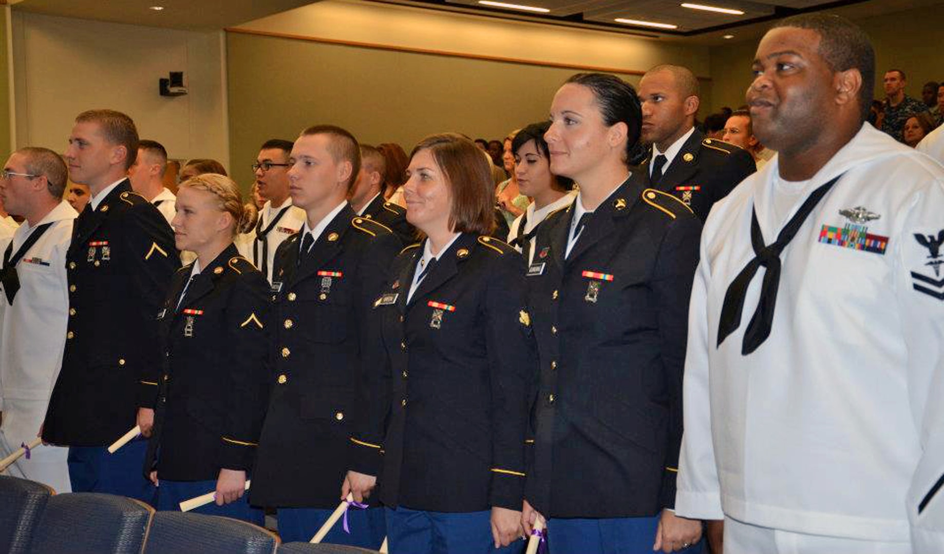 Army and Navy students in the first consolidated Preventive Medicine program graduation at the Medical Education & Training Campus.