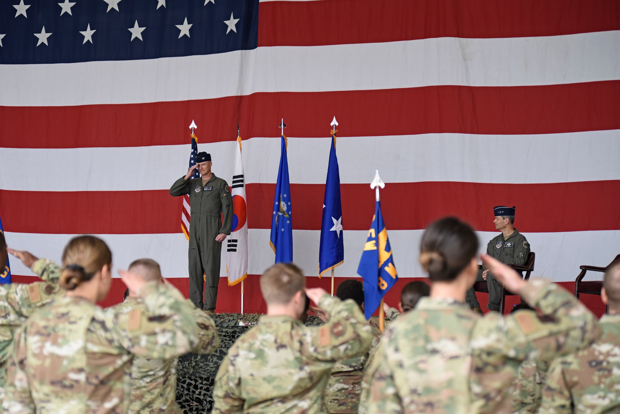 Col. Christopher Hammond, 8th Fighter Wing commander, gives his first salute as Wolf 60 during the 8th FW change of command ceremony at Kunsan Air Base, Republic of Korea, June 2, 2020. As Wolf 60, Hammond is responsible for more than 2,700 active-duty personnel, four groups and 13 squadrons, including two F-16 squadrons tasked with supporting 7th Air Force operational readiness. (U.S. Air Force photo by Staff Sgt. Mackenzie Mendez)