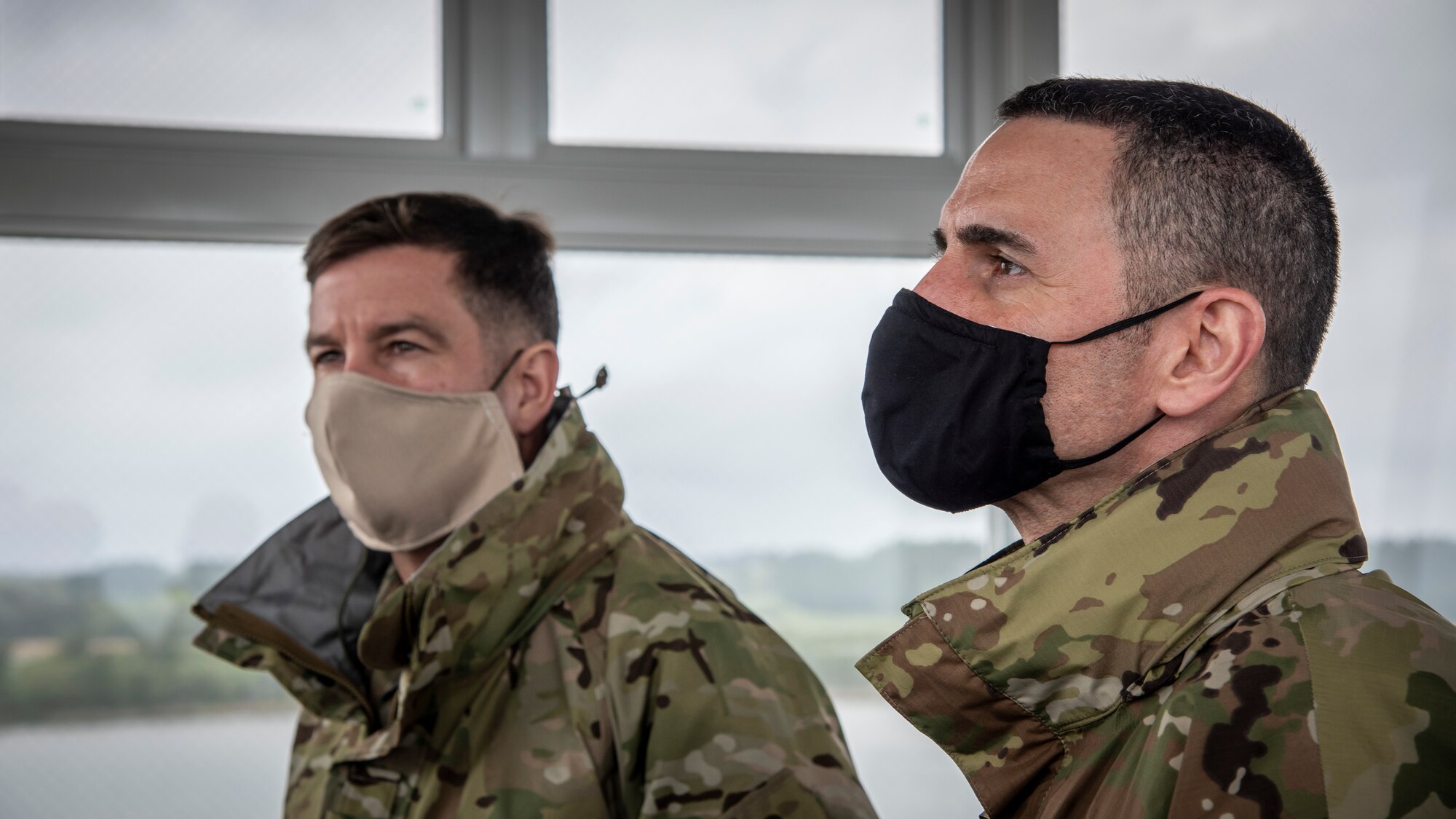 U.S. Air Force Chief Master Sgt. Rick Winegardner Jr., left, the U.S. Forces Japan senior enlisted leader, and Chief Master Sgt. Brian Kruzelnick, right, the Fifth Air Force command chief, observe the range from a tower at Draughon Range near Misawa Air Base, Japan, May 20, 2020. Winegardner and Kruzelnick noted the capabilities of the range and the role it plays in the training of the suppression of enemy air defense mission to Misawa aviators, specifically. The SEAD mission requires a pilot’s ability to put bombs on target and defend against surface-to-air missiles to ensure the protection of U.S. assets and personnel. (U.S. Air Force photo by Airman 1st Class China M. Shock)