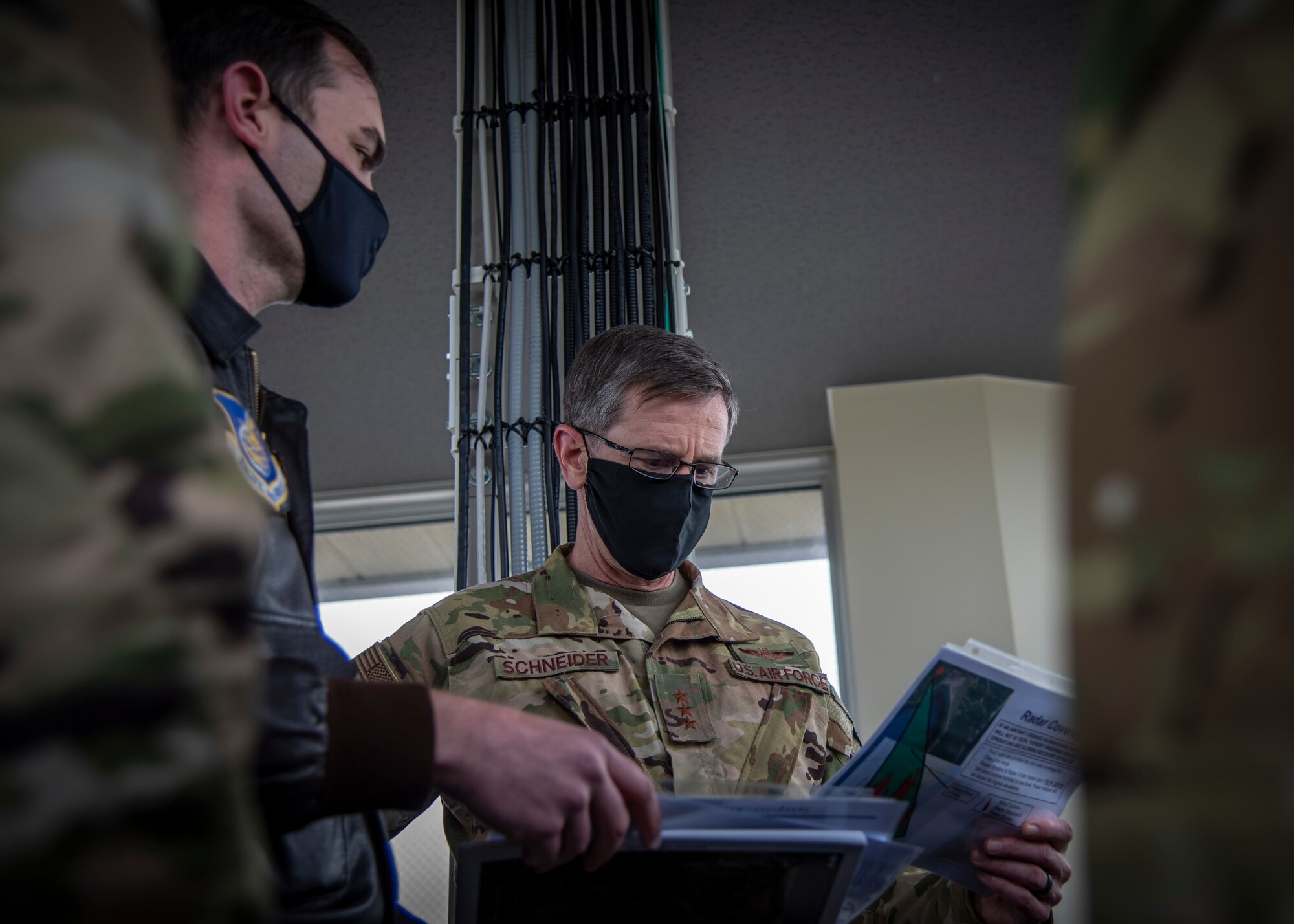 U.S. Air Force Maj. Daniel House, left, the 35th Operations Support Squadron assistant director of operations, talks to Lt. Gen. Kevin B. Schneider, right, the U.S. Forces Japan and Fifth Air Force commander, at Draughon Range near Misawa Air Base, Japan, May 20, 2020. Draughon Range is the premier air-to-ground training site located in Japan, focusing on suppression of enemy air defense air operations. Members of the 35th Fighter Wing and other units throughout the Western Pacific train at the range to focus on SEAD and munition employment, combat search and rescue, and survival, evasion, resistance, and escape, ultimately enhancing the readiness and lethality of U.S. forces in this region. (U.S. Air Force photo by Airman 1st Class China M. Shock)