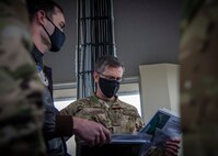 U.S. Air Force Maj. Daniel House, left, the 35th Operations Support Squadron assistant director of operations, talks to Lt. Gen. Kevin B. Schneider, right, the U.S. Forces Japan and Fifth Air Force commander, at Draughon Range near Misawa Air Base, Japan, May 20, 2020. Draughon Range is the premier air-to-ground training site located in Japan, focusing on suppression of enemy air defense air operations. Members of the 35th Fighter Wing and other units throughout the Western Pacific train at the range to focus on SEAD and munition employment, combat search and rescue, and survival, evasion, resistance, and escape, ultimately enhancing the readiness and lethality of U.S. forces in this region. (U.S. Air Force photo by Airman 1st Class China M. Shock)