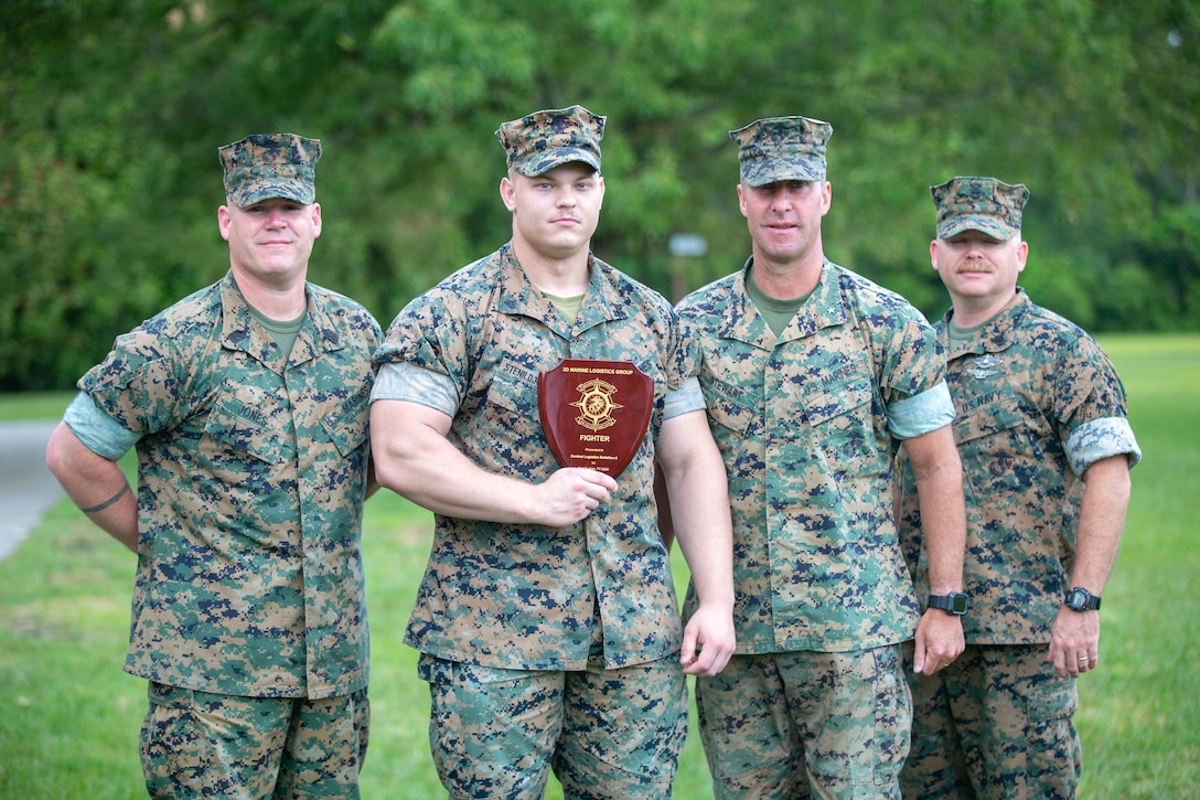 Marines with 2nd Marine Logistics Group receive unit awards as part of 2nd MLG’s unit recognition program at Camp Lejeune, North Carolina, May 28, 2020. (U.S. Marine Corps photo by Lance Cpl. Scott Jenkins)
