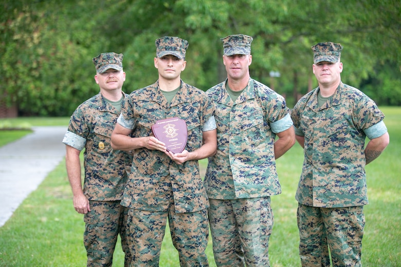 Marines with 2nd Marine Logistics Group receive unit awards as part of 2nd MLG’s unit recognition program at Camp Lejeune, North Carolina, May 28, 2020. (U.S. Marine Corps photo by Lance Cpl. Scott Jenkins)
