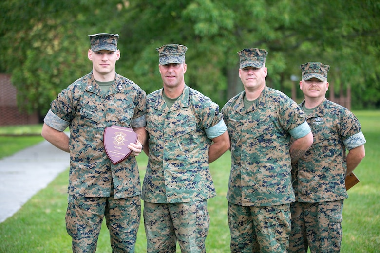 Marines with 2nd Marine Logistics Group receive unit awards as part of 2nd MLG’s unit recognition program at Camp Lejeune, North Carolina, May 28, 2020. (U.S. Marine Corps photo by Lance Cpl. Scott Jenkins)