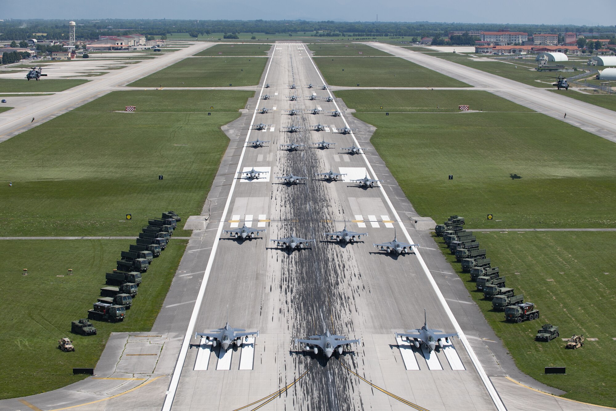 U.S. Air Force aircraft and vehicles assigned to the 31st Fighter Wing line the runway during an elephant walk at Aviano Air Base, Italy, June 1, 2020. Despite the restrictions in place due to COVID-19, the 31st FW remains lethal and combat ready, prepared to deter or defeat any adversary who threatens U.S. or NATO interests. (U.S. Air Force photo by Airman Thomas S. Keisler IV)