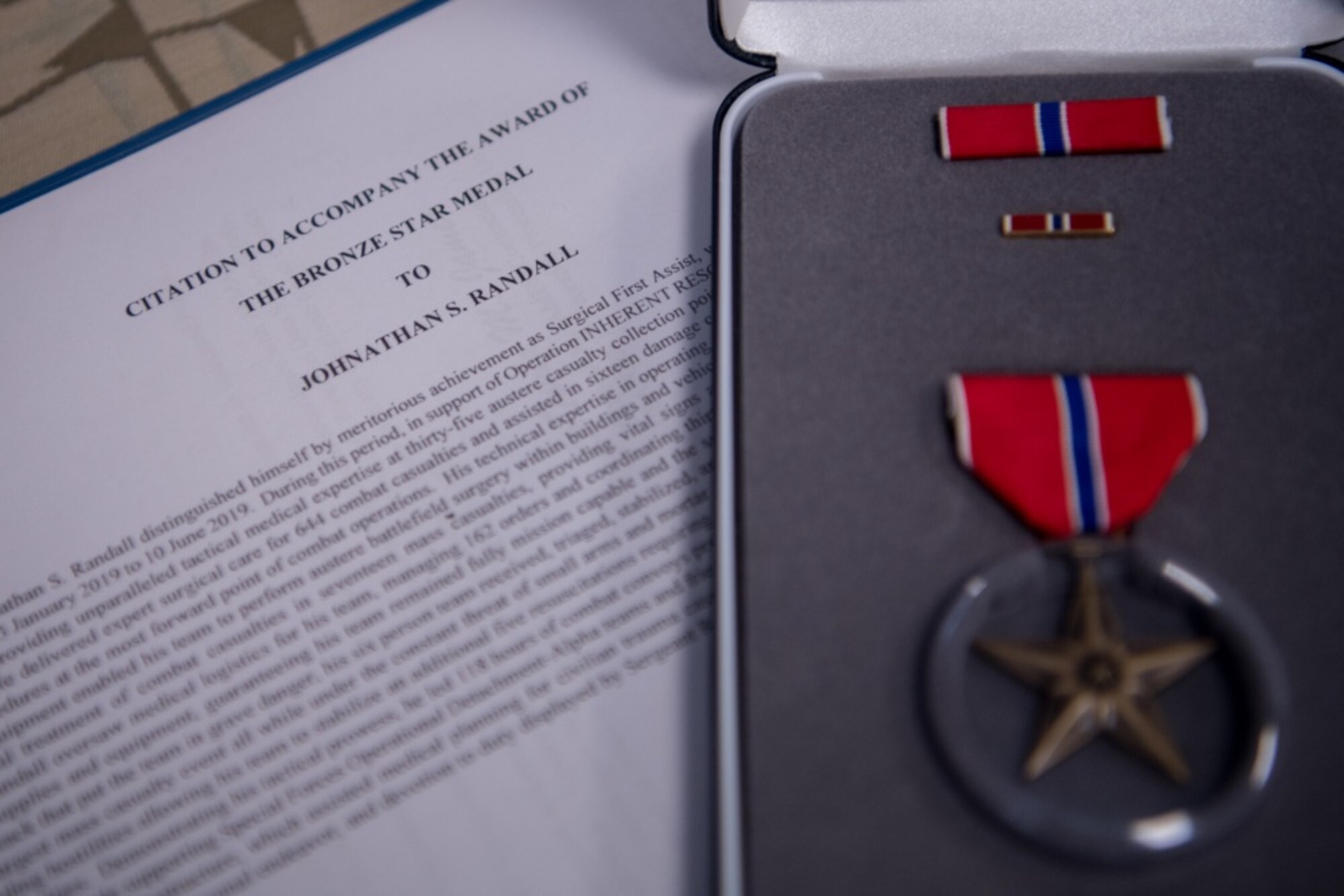 An awards decoration and Bronze Star medal lay on a table