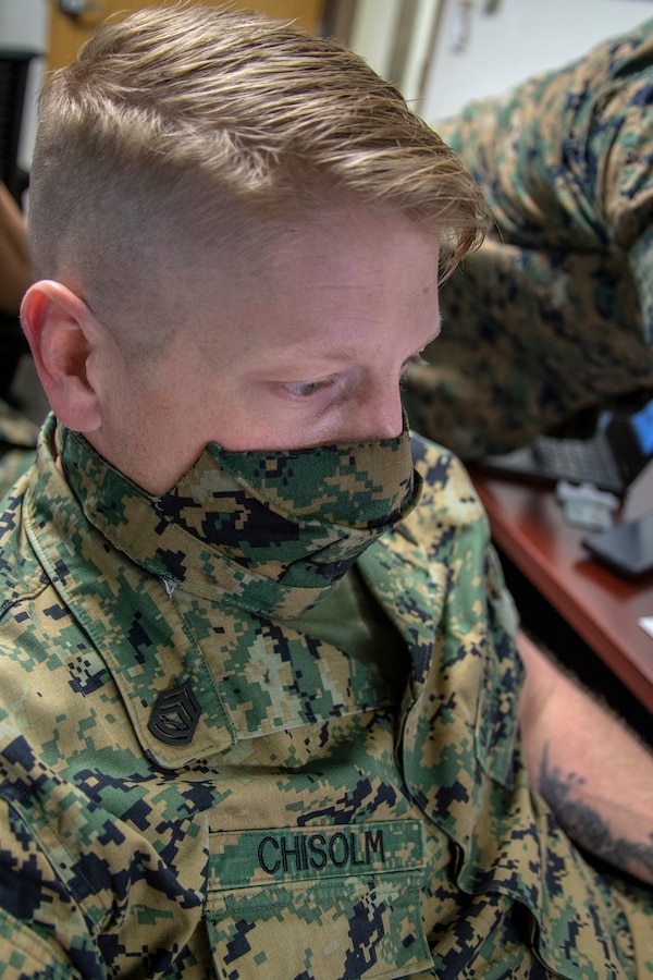 Gunnery Sgt. Joshua Chisolm, a civil affairs specialist with Special Purpose Marine Air-Ground Task Force - Southern Command, prepares a foreign area of operations brief during a certification exercise at Marine Corps Base Camp Lejeune, North Carolina, April 21, 2020. The CERTEX is the culmination exercise that will test the training and readiness of the Marines and Sailors of the SPMAGTF-SC for certification to deploy. Once certified, the SPMAGTF-SC will be ready to conduct crisis response, theater security cooperation training and general engineering projects alongside partner nation militaries in Latin America and the Caribbean. Chisolm is a native of Lexington, South Carolina. (U.S. Marine Corps photo by Cpl. Benjamin D. Larsen)