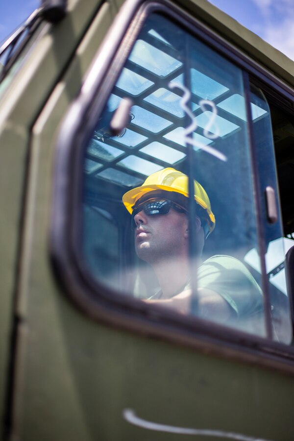 Sgt. Joel VanderKooy, a food service specialist with Special Purpose Marine Air-Ground Task Force - Southern Command, operates a Military Millennia Vehicle extended boom forklift during a heavy equipment training exercise at Camp Lejeune, North Carolina, May 13, 2020. These training events assist the Marines and Sailors when working alongside partner nations in Latin America and the Caribbean with crisis response preparedness, security cooperation training, and engineering projects. VanderKooy is a native of Mount Vernon, Washington. (U.S. Marine Corps photo by Cpl. Benjamin D. Larsen)
