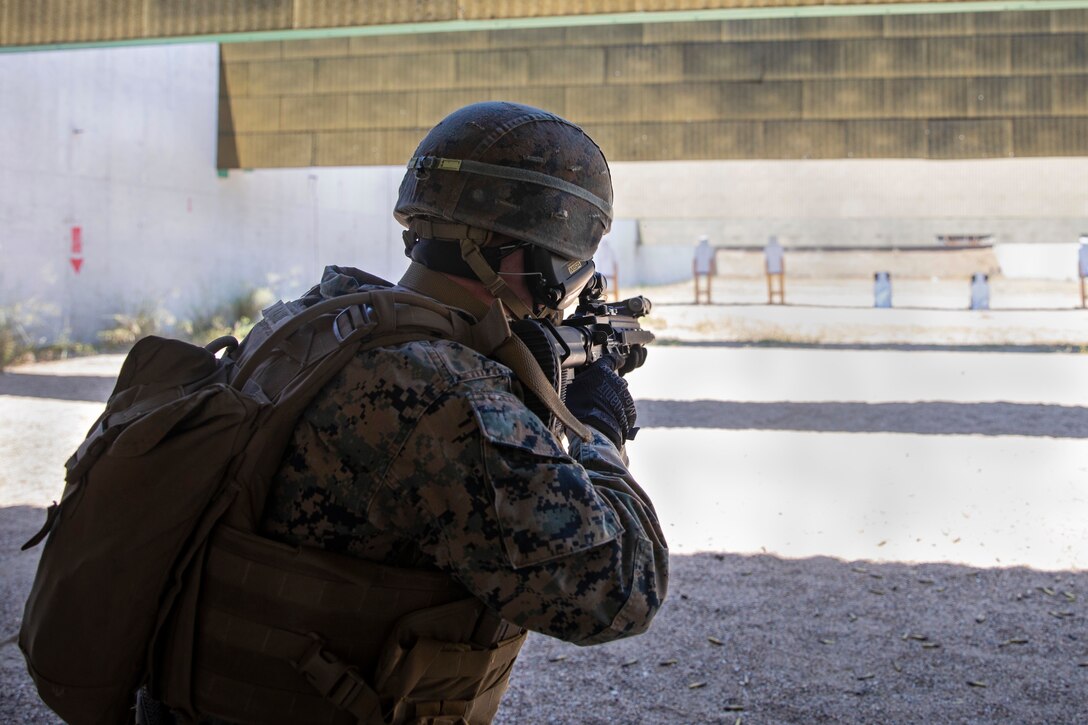 A U.S. Marine with Special Purpose Marine Air-Ground Task Force-Crisis Response-Africa 20.2, focuses on his target during a combat marksmanship range on Móron Air Base, Spain, June 1, 2020. SPMAGTF-CR-AF 20.2 is deployed to conduct crisis-response and theater-security operations in Africa and promote regional stability by conducting military-to-military training exercises throughout Europe and Africa. SPMAGTF-CR-AF 20.2 continues to work closely with the relevant medical agencies, military organizations to minimize the risk of COVID-19 exposure. (U.S. Marine Corps photo by Cpl. Antonio F. Garcia/Released)