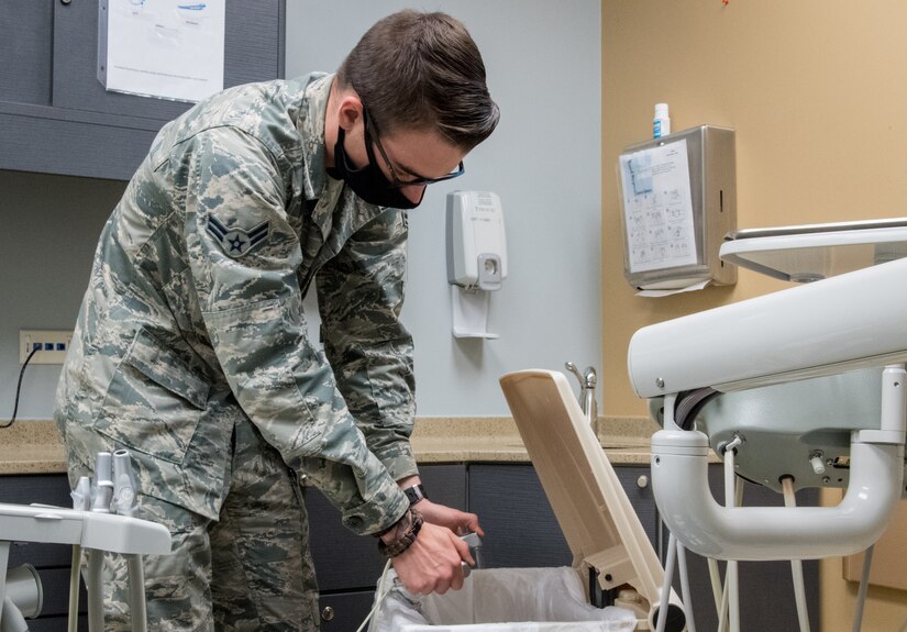 An Air Force dental technician shocking water lines.