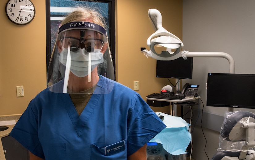 An Air Force periodontist wears protective gear.