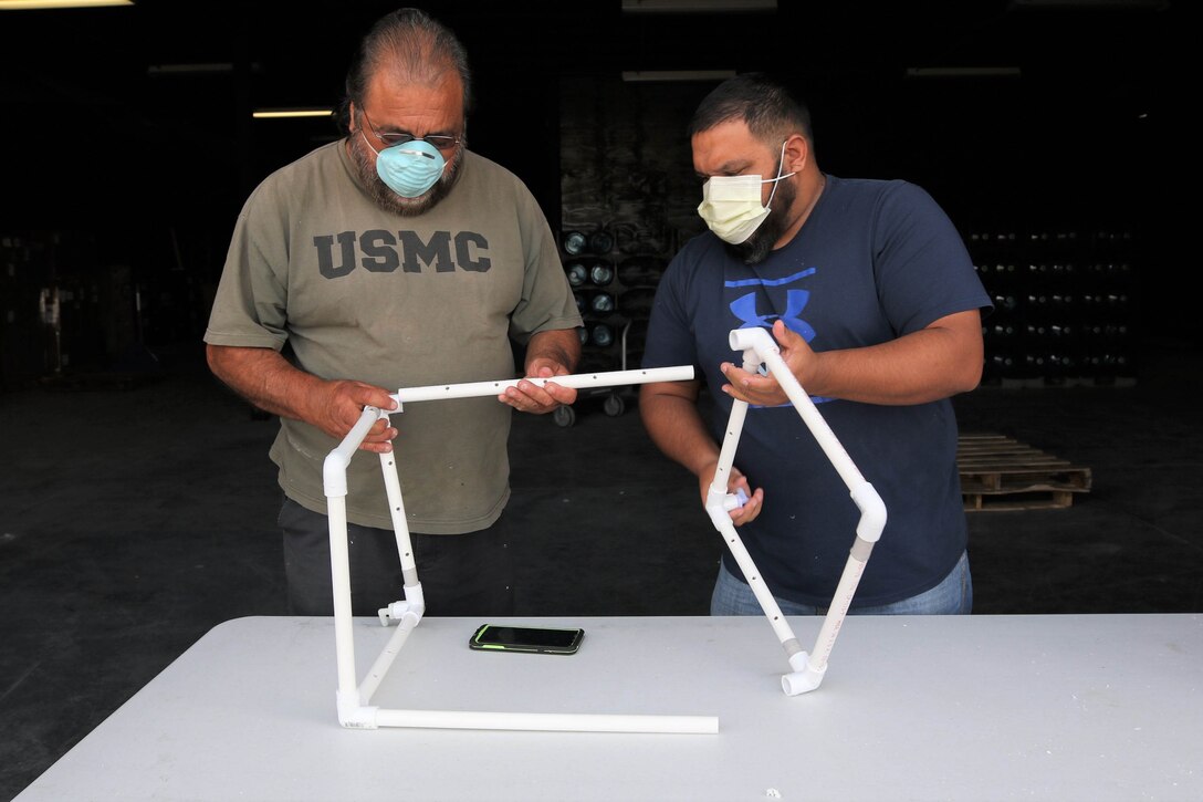 Maintenance workers assembling a CAMIC.